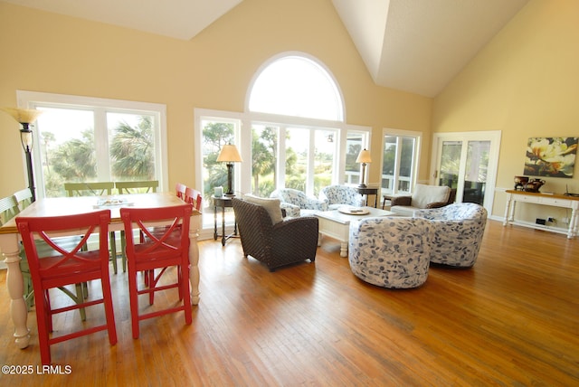 101 Ocean Point Dr, Fripp Island, SC 29920 - living area with high vaulted ceiling, hardwood / wood-style floors, and healthy amount of natural light
