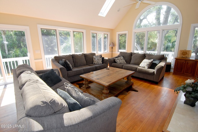101 Ocean Point Dr, Fripp Island, SC 29920 - living area with high vaulted ceiling, plenty of natural light, ceiling fan, a skylight, and wood finished floors