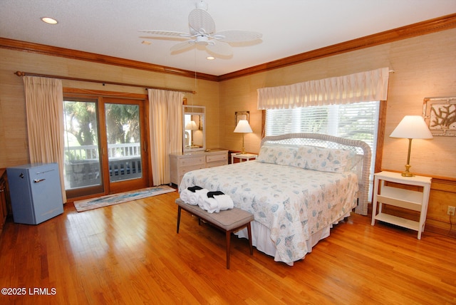 101 Ocean Point Dr, Fripp Island, SC 29920 - bedroom featuring access to exterior, light wood finished floors, crown molding, and a ceiling fan