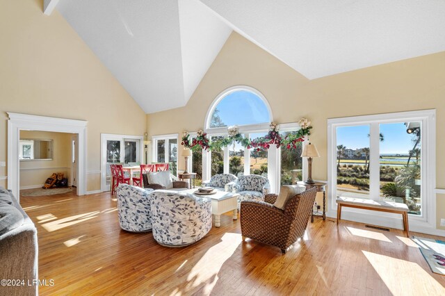 sunroom with a wealth of natural light and vaulted ceiling