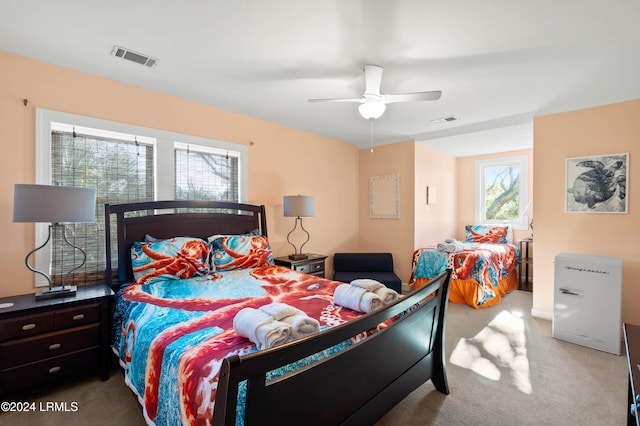 bedroom with ceiling fan and carpet floors