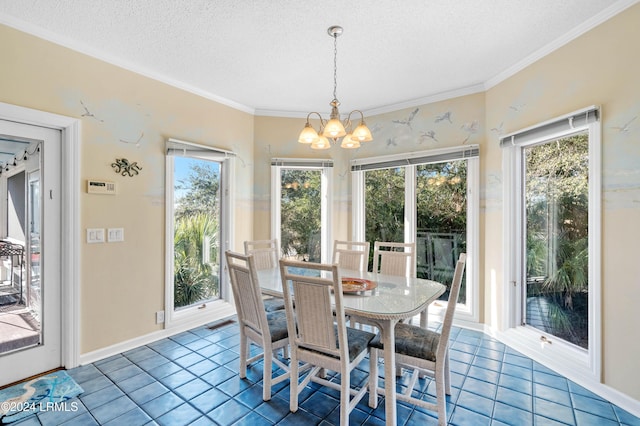 tiled dining area with an inviting chandelier, crown molding, and a textured ceiling