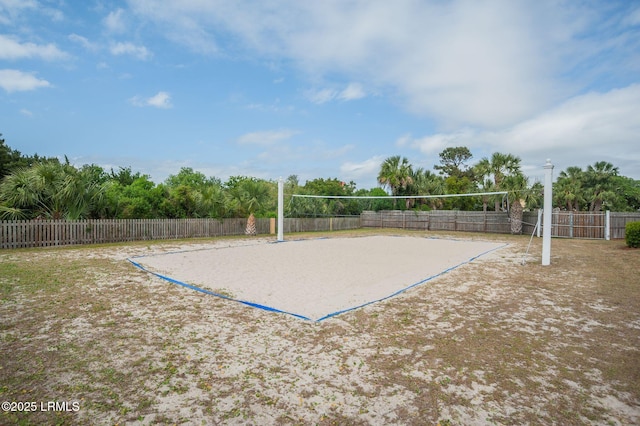 surrounding community with fence and volleyball court