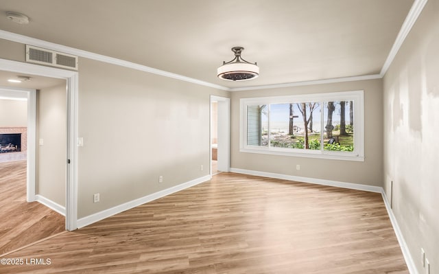 83 Sunset Blvd, Beaufort, SC 29907 - unfurnished room with visible vents, light wood-type flooring, ornamental molding, and baseboards