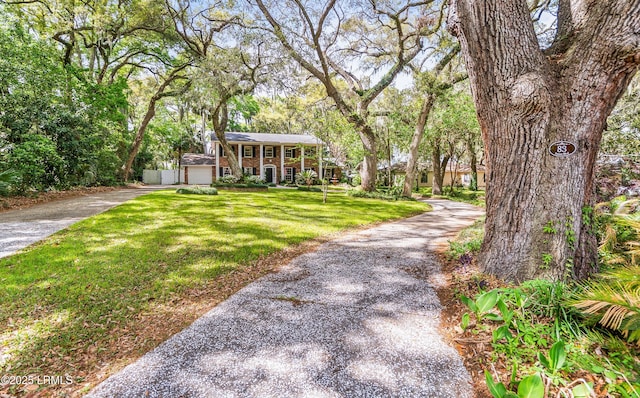 83 Sunset Blvd, Beaufort, SC 29907 - colonial inspired home with driveway, a front yard, and brick siding