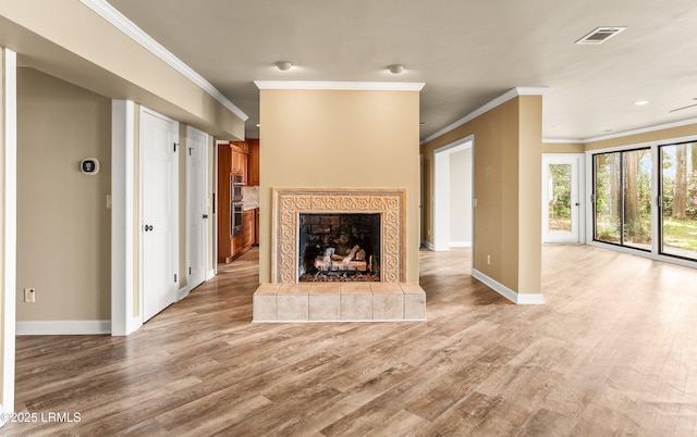 83 Sunset Blvd, Beaufort, SC 29907 - unfurnished living room featuring baseboards, light wood-style floors, and crown molding