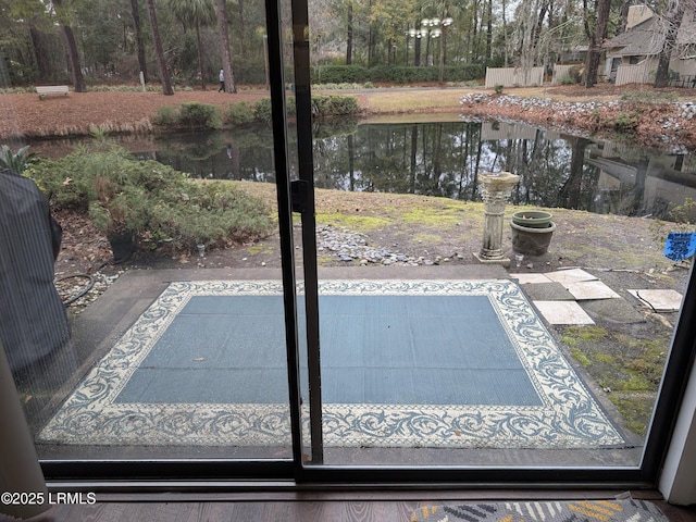 doorway to outside with a water view