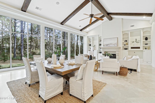 sunroom with a ceiling fan, vaulted ceiling with beams, a fireplace, and visible vents