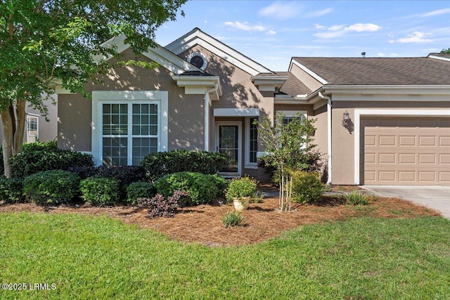 52 Summerplace Dr, Bluffton, SC 29909 - view of front facade with stucco siding, a front lawn, concrete driveway, and a garage