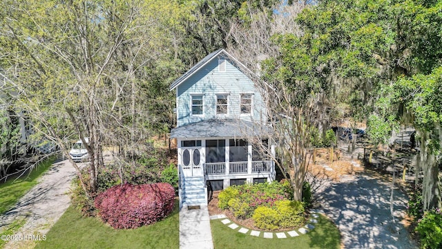 89 Bostick Cir, Beaufort, SC 29902 - view of front of house featuring a sunroom and stairway