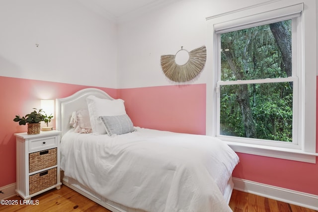 89 Bostick Cir, Beaufort, SC 29902 - bedroom featuring multiple windows, wood finished floors, crown molding, and baseboards