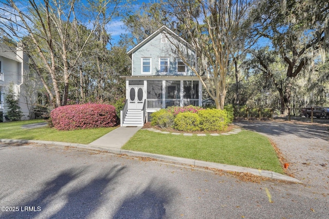 89 Bostick Cir, Beaufort, SC 29902 - view of front of home with a sunroom and a front lawn