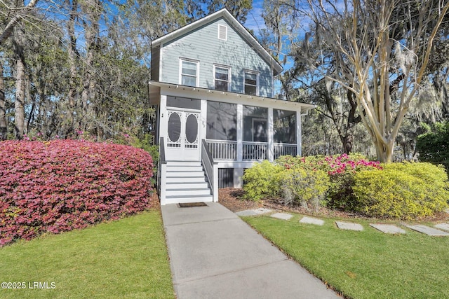 89 Bostick Cir, Beaufort, SC 29902 - view of front of house with a sunroom and a front lawn
