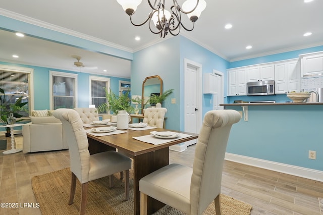 89 Bostick Cir, Beaufort, SC 29902 - dining room featuring light wood-style flooring, recessed lighting, a chandelier, crown molding, and baseboards