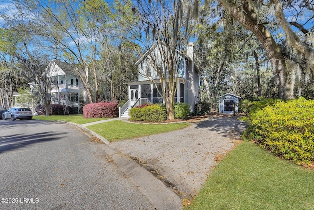 89 Bostick Cir, Beaufort, SC 29902 - view of front of home featuring a sunroom and a front lawn