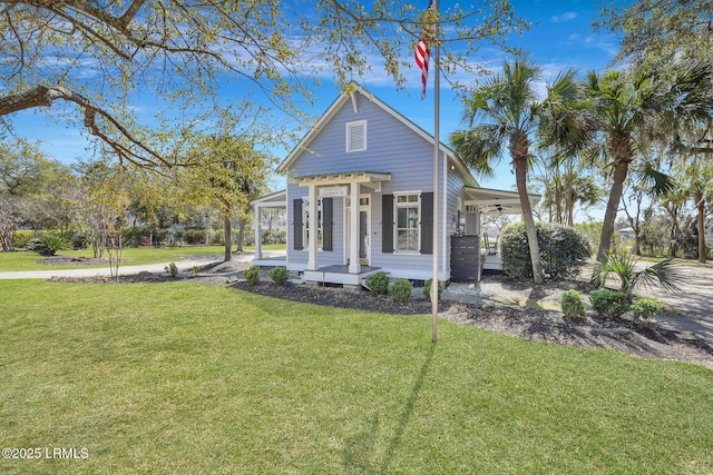 89 Bostick Cir, Beaufort, SC 29902 - view of front of home featuring a porch, a front yard, an attached carport, and ceiling fan