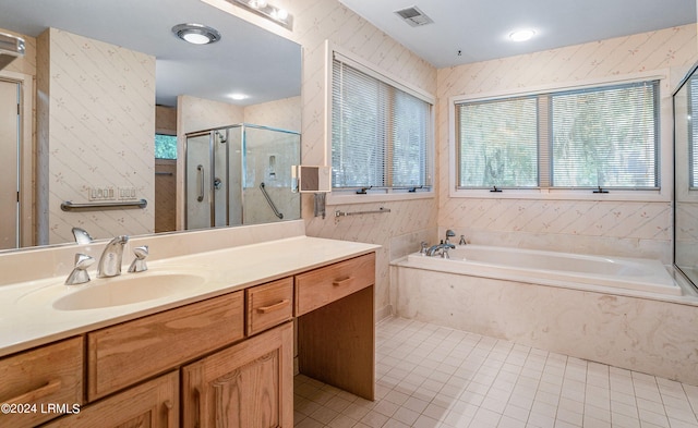 bathroom with vanity, tile patterned flooring, and independent shower and bath