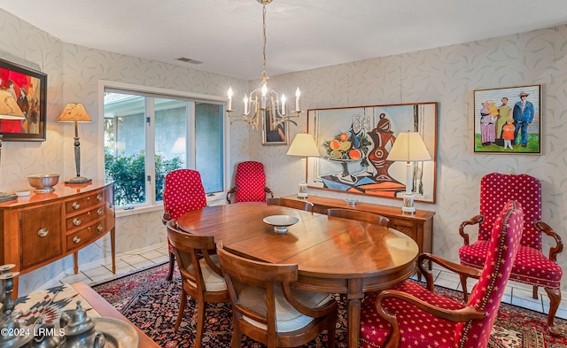 tiled dining space with a chandelier