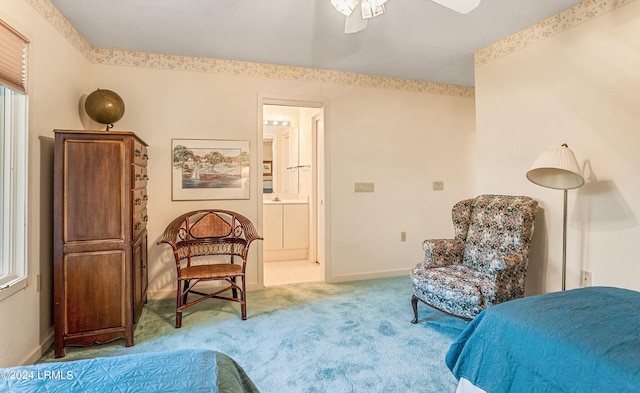 carpeted bedroom featuring ceiling fan and connected bathroom