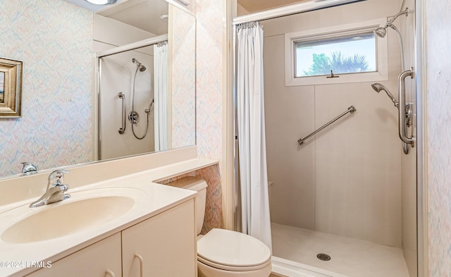 bathroom featuring vanity, toilet, and a shower with shower curtain