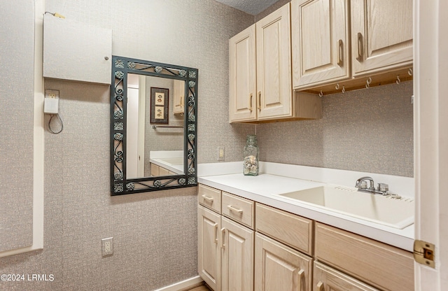 kitchen featuring sink and light brown cabinets