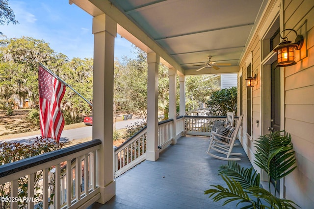 balcony featuring a porch and a ceiling fan