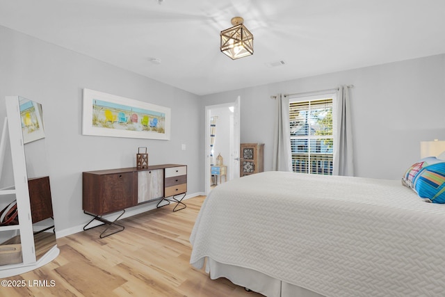 bedroom featuring hardwood / wood-style flooring