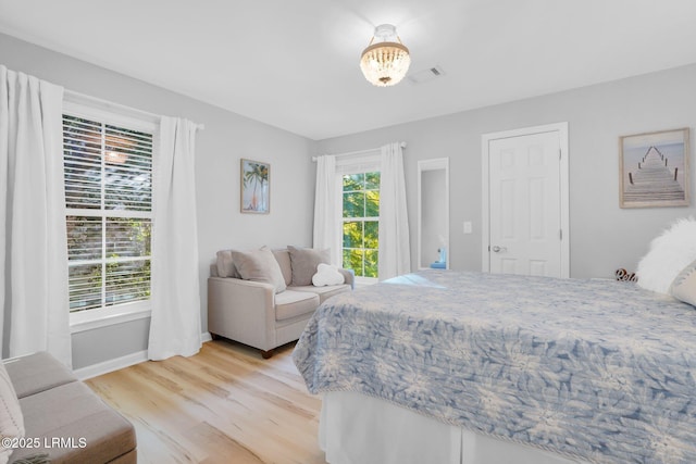 bedroom with light hardwood / wood-style floors