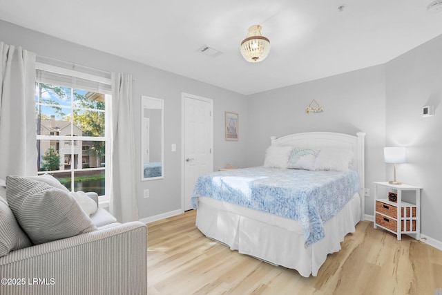 bedroom with light hardwood / wood-style floors