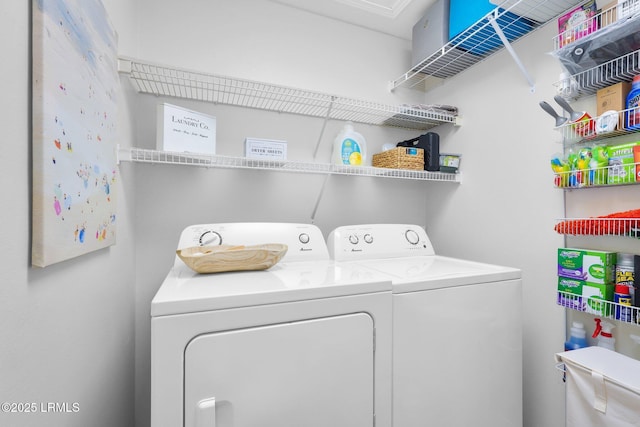 laundry area featuring washing machine and clothes dryer