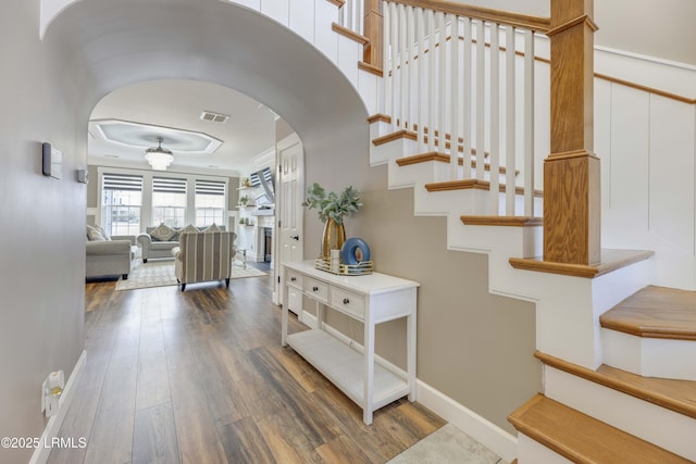 stairs featuring wood-type flooring