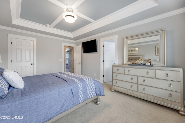 carpeted bedroom featuring a tray ceiling, ornamental molding, and ceiling fan