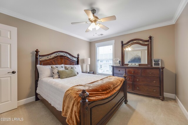 bedroom featuring crown molding, light colored carpet, and ceiling fan