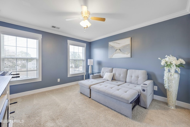 living room featuring crown molding, light colored carpet, and ceiling fan