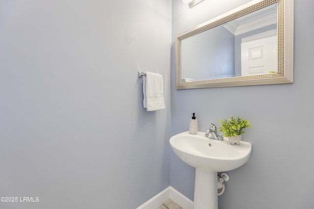 bathroom featuring crown molding