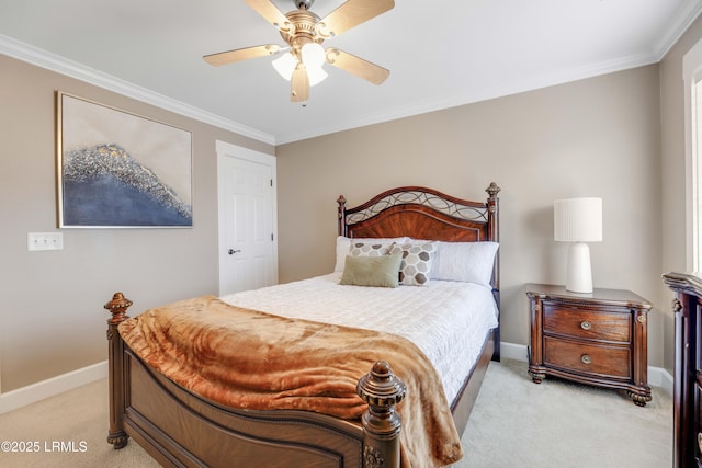 carpeted bedroom with ornamental molding and ceiling fan