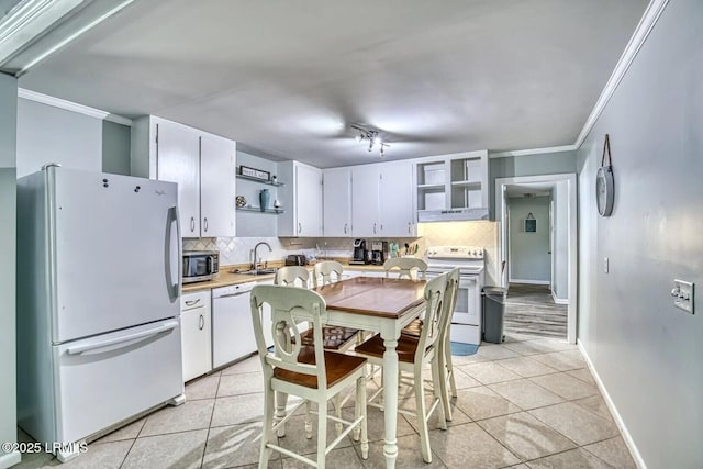 kitchen with white appliances, light tile patterned floors, under cabinet range hood, and open shelves