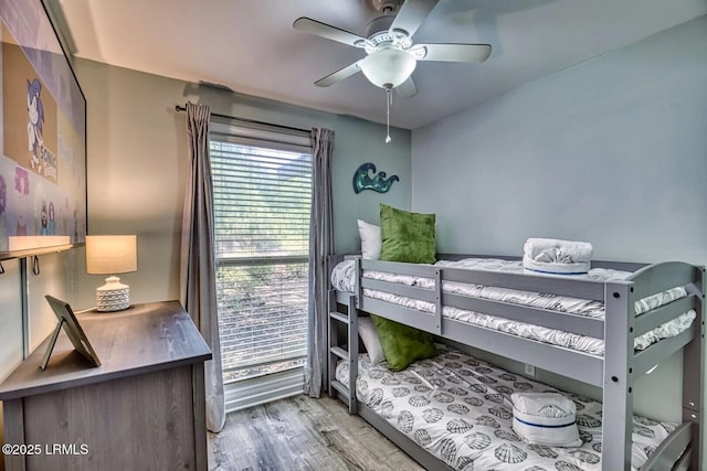 bedroom featuring light wood-type flooring and ceiling fan