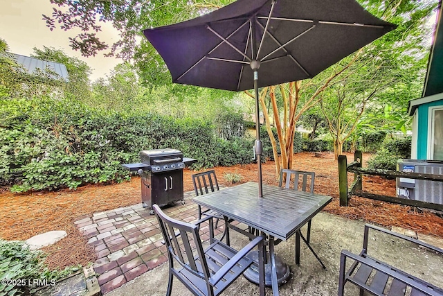 view of patio featuring central AC, outdoor dining space, and a grill