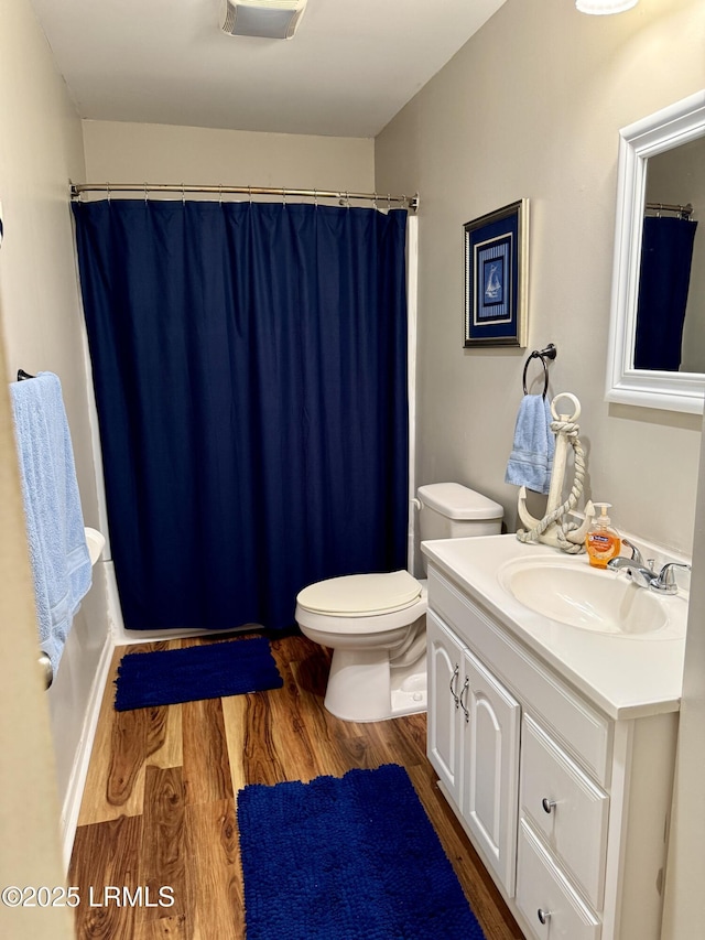 26 Mallard St, Ridgeland, SC 29936 - bathroom with vanity, wood finished floors, and shower / tub combo with curtain