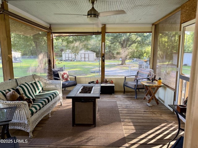 26 Mallard St, Ridgeland, SC 29936 - sunroom featuring an outdoor living space with a fire pit, ceiling fan, and plenty of natural light