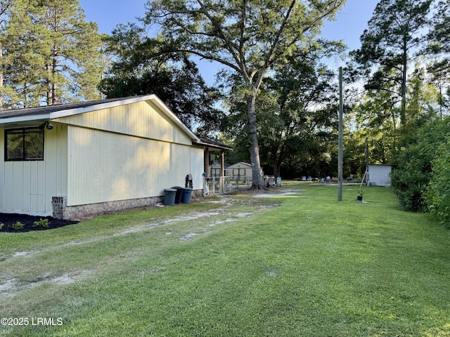 26 Mallard St, Ridgeland, SC 29936 - view of grassy yard featuring an outbuilding
