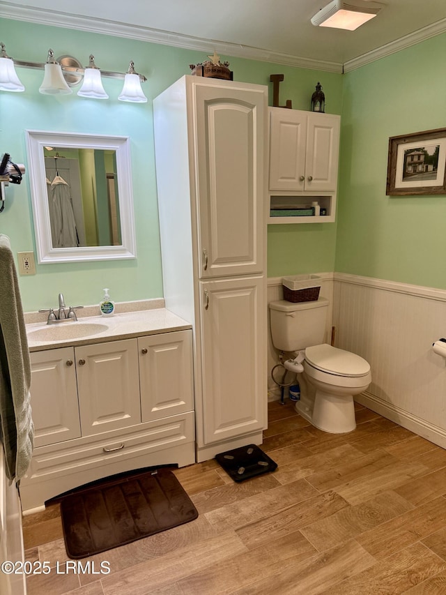 26 Mallard St, Ridgeland, SC 29936 - bathroom with wood finished floors, vanity, a wainscoted wall, and crown molding