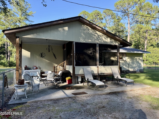 26 Mallard St, Ridgeland, SC 29936 - rear view of property featuring a sunroom and a patio