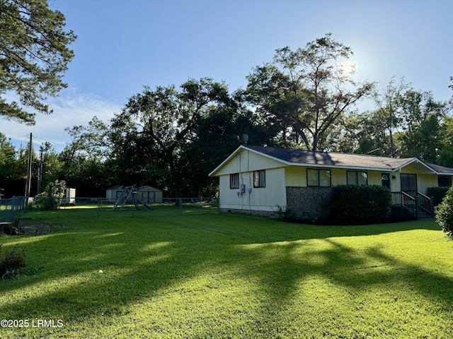 26 Mallard St, Ridgeland, SC 29936 - fenced backyard featuring a storage shed