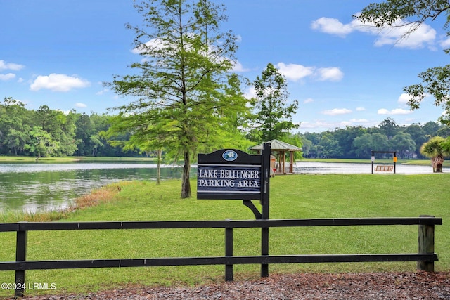 view of home's community with a gazebo, a water view, and a yard