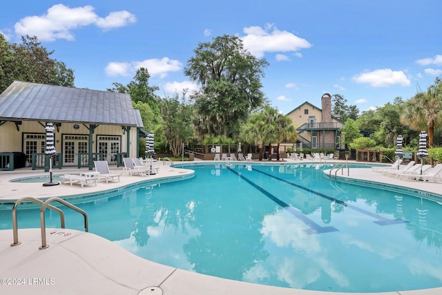 view of swimming pool featuring a patio area