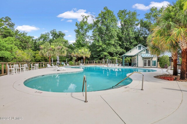 view of pool featuring a patio