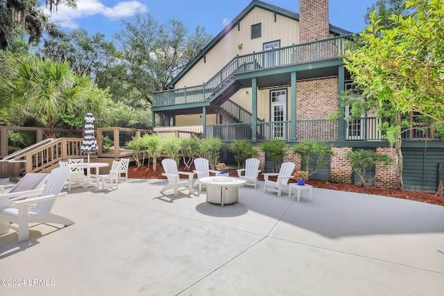 view of patio / terrace featuring an outdoor fire pit