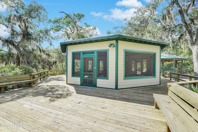 wooden deck with an outdoor structure